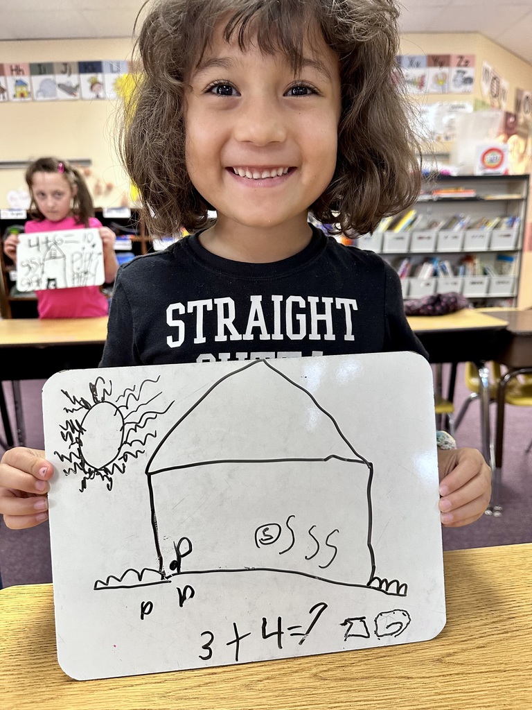 2nd grade student and their math work