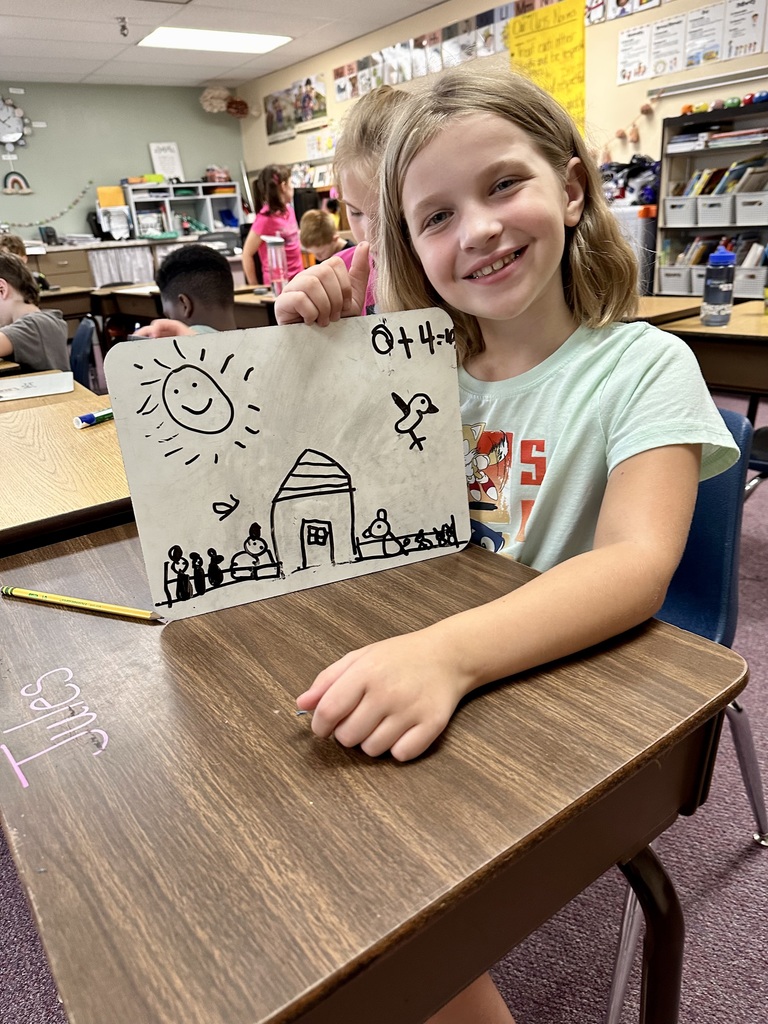 2nd grade student and their math work