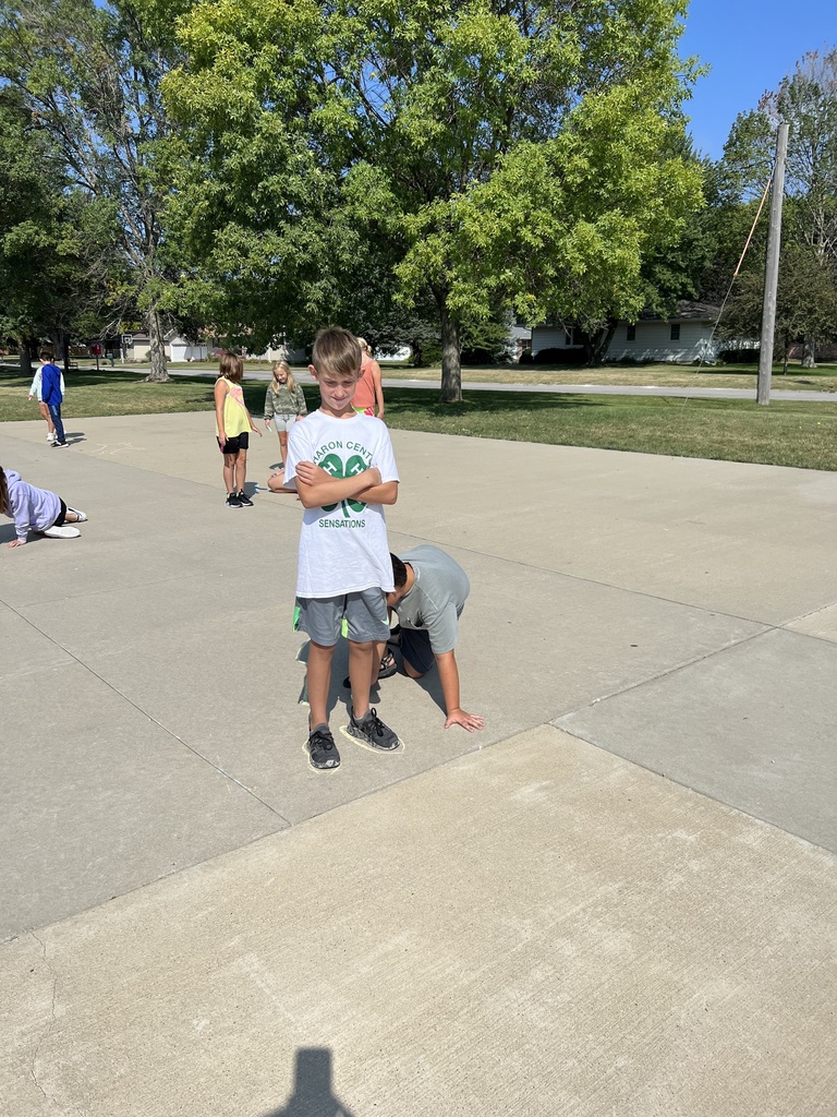student tracing a shadow