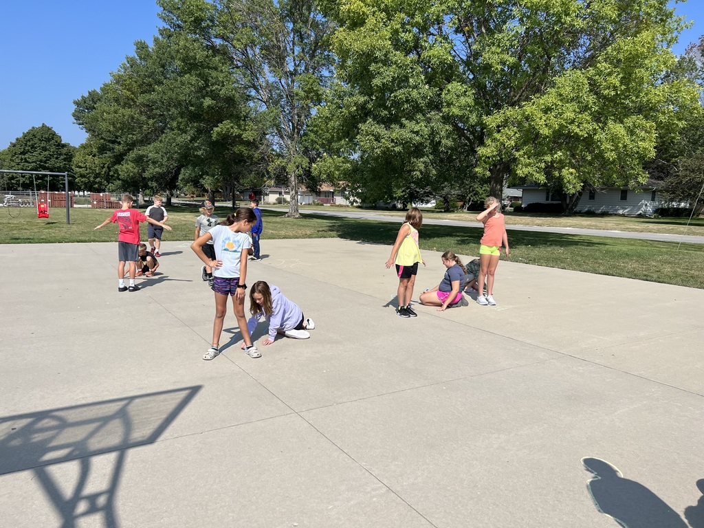 students tracing shadows