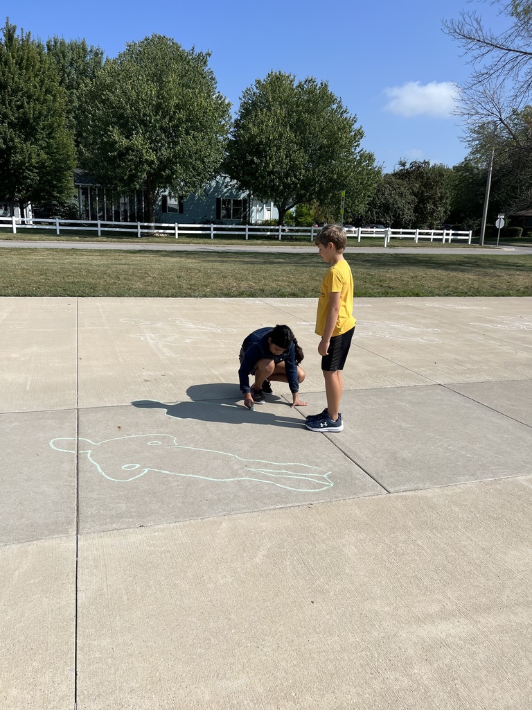 student tracing a shadow