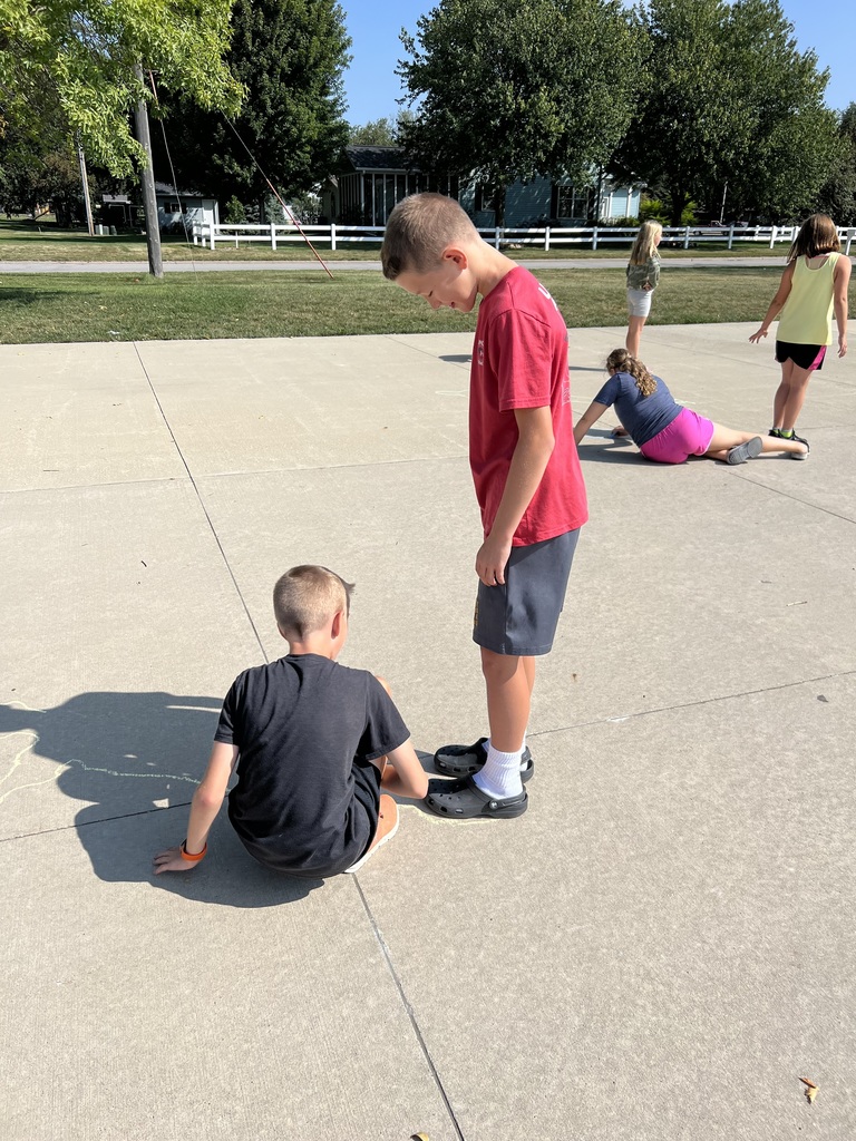 student tracing a shadow