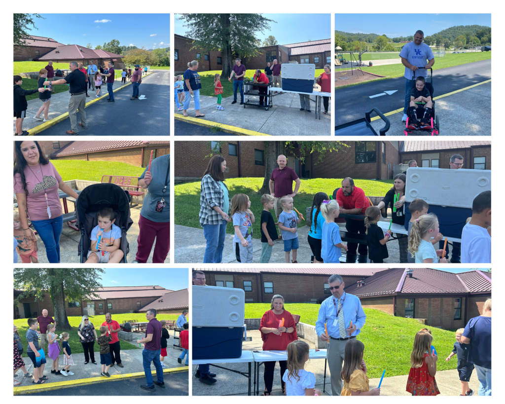 Owsley County School Administrators along with SRO, Claude Hudson, serving popsicles to OCES students and teachers before the holiday weekend.