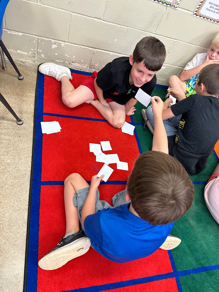 students with flash cards 
