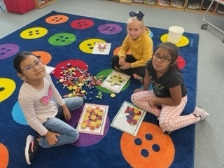 3 girls playing a math game