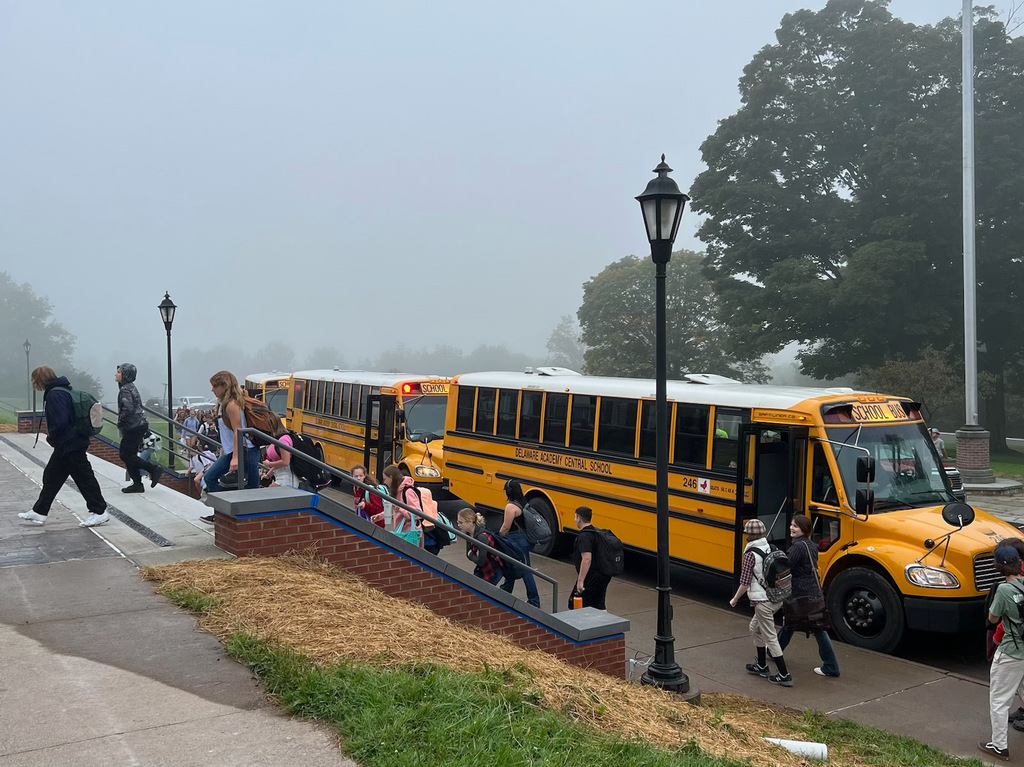students disembark in front of Delaware Academy