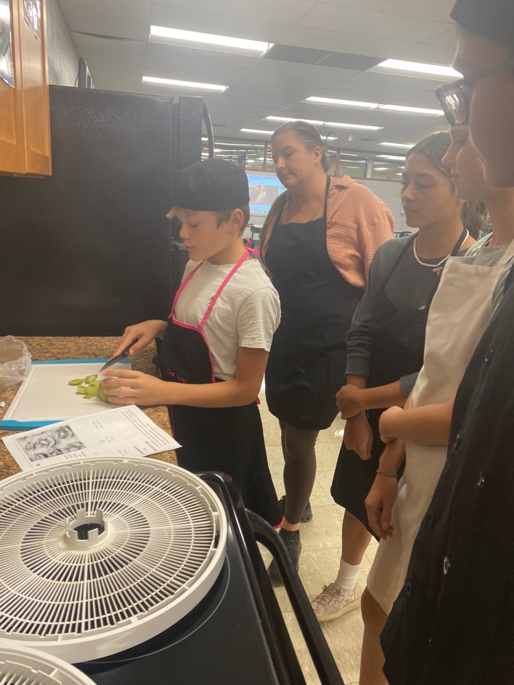 JH FACS students learning knife skills.