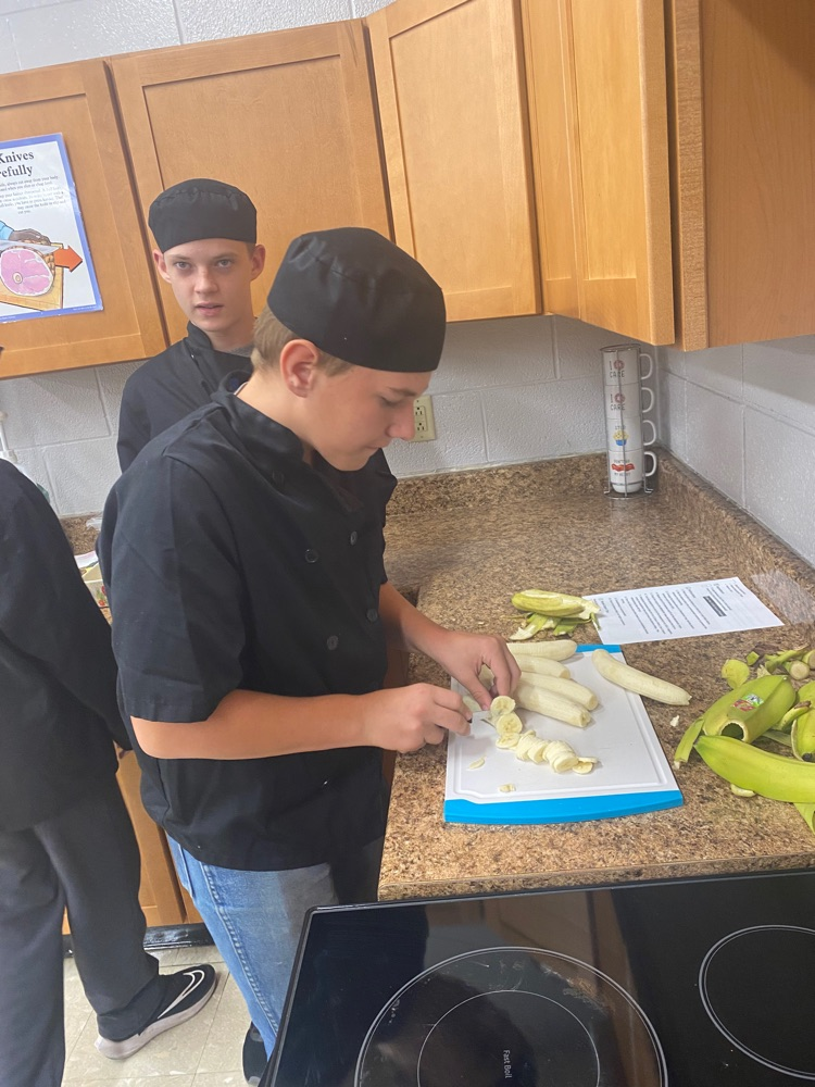 JH FACS students learning knife skills.