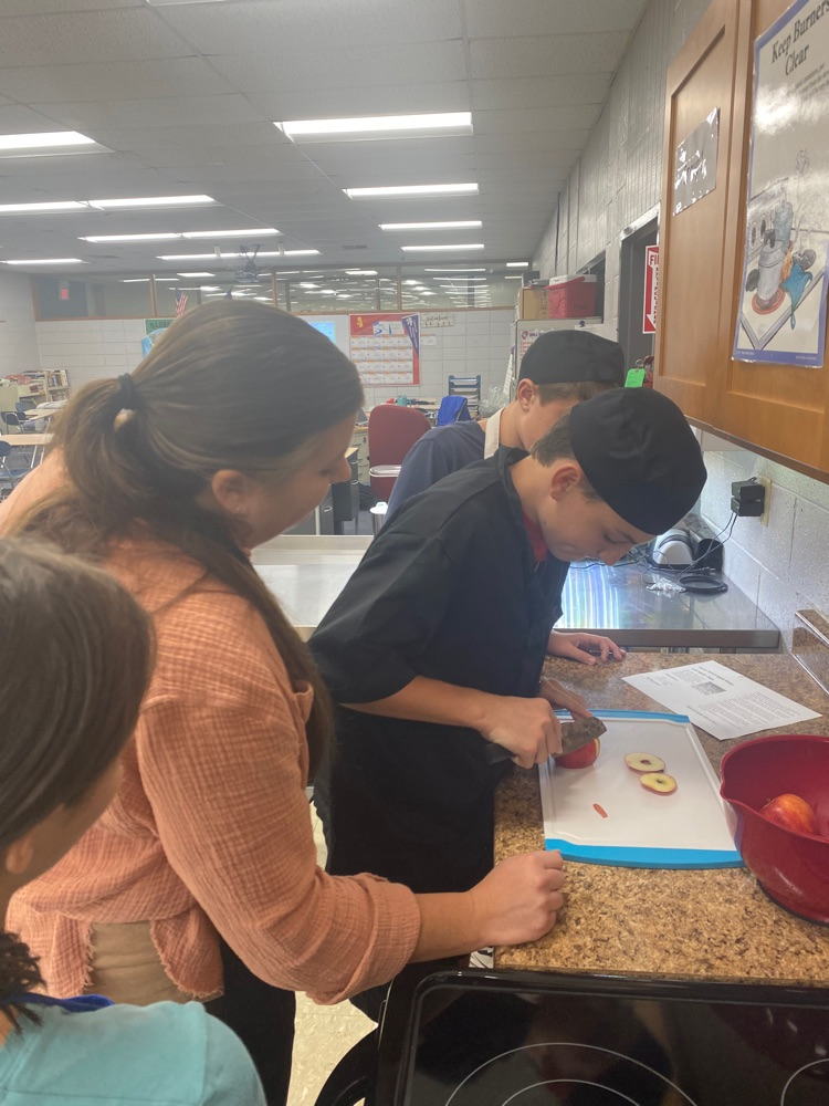 JH FACS students learning knife skills.
