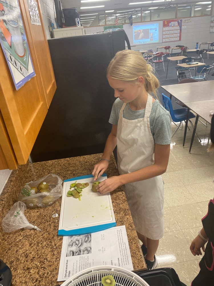 JH FACS students learning knife skills.