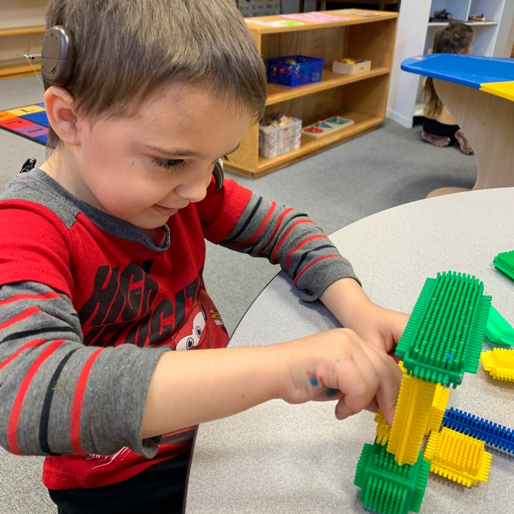 a student playing lego