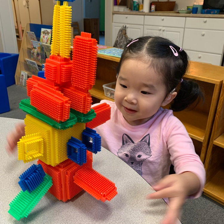 a student playing Lego