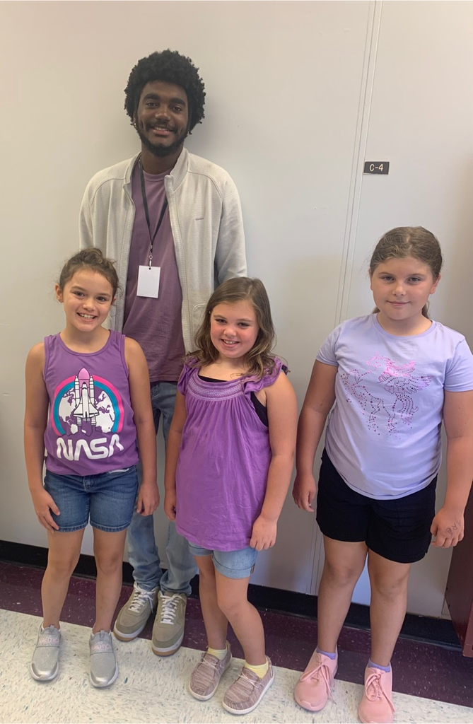 students and staff wearing purple