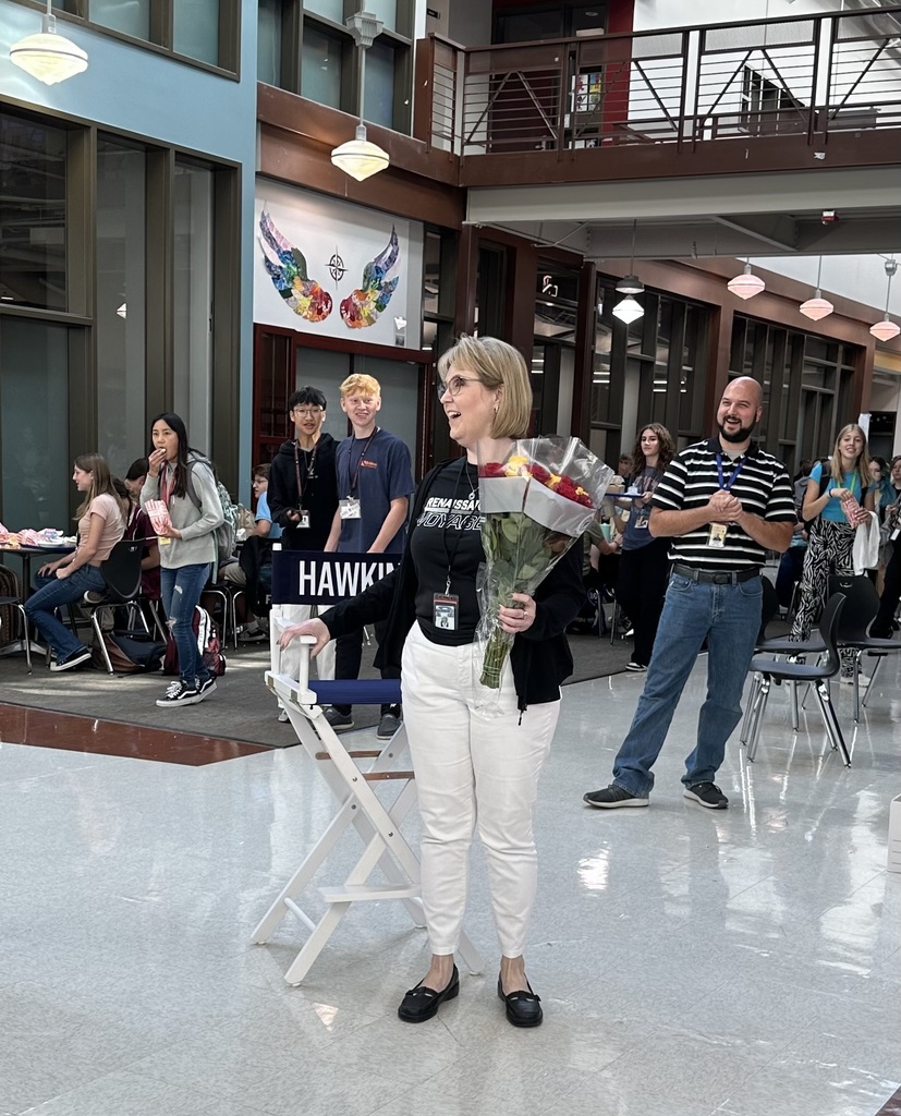 Dr. Hawkins with flowers & director's chair