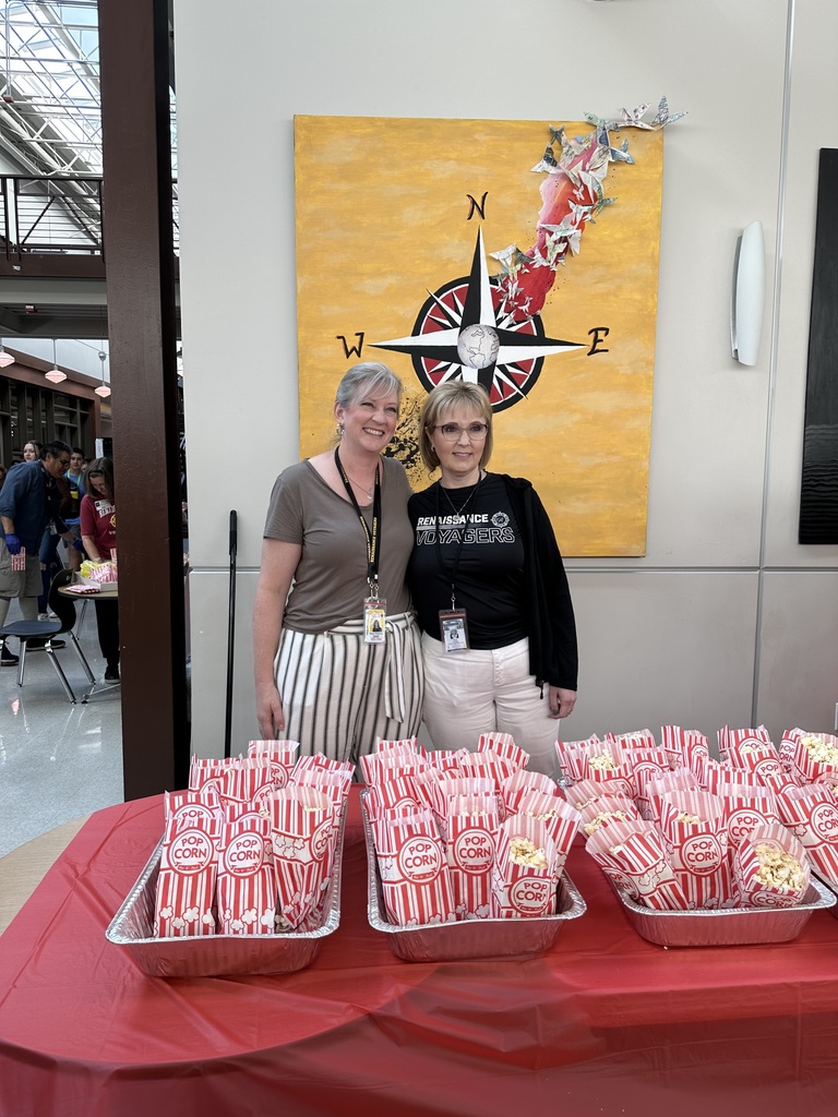 Principal McGroarty & Dr. Hawkins with bags of popcorn