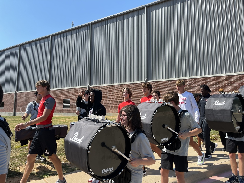 Tyler Legacy Varsity football walking to their bus through of send off from Southern Belle Drill Team, drumline, and cheer