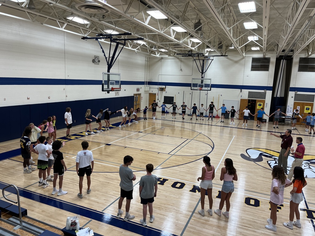 8th grade students prepare to conduct a team building activity