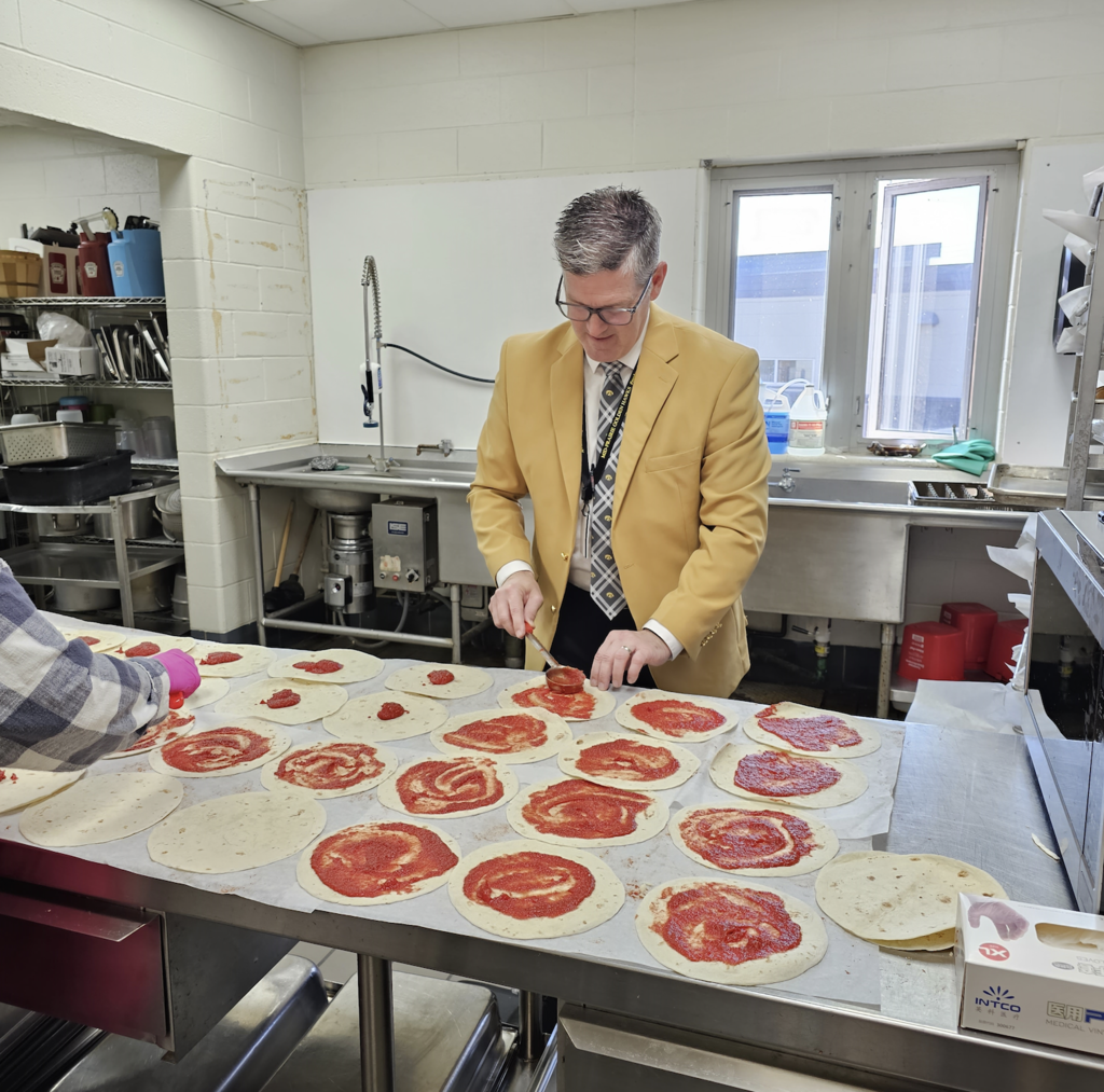 Mr. Stone making pizza wraps