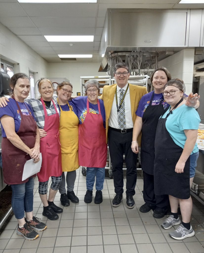 Mr. Stone with kitchen staff