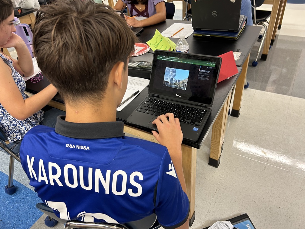 Students examining images from 9/11 timeline
