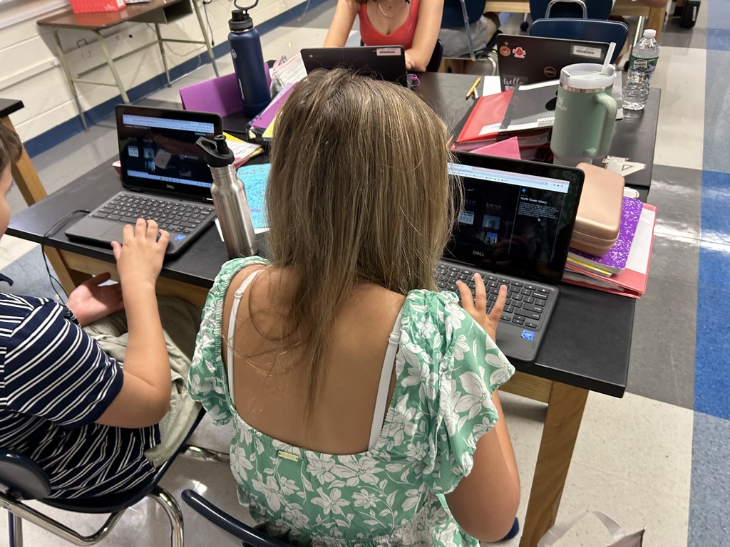 Students examining articles & images 9/11 timeline