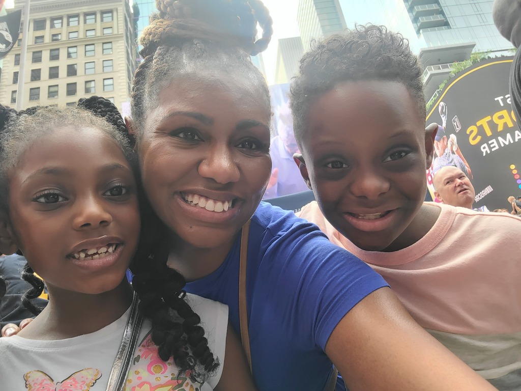 Ethan and his family celebrating his billboard photo in Times Sqaure