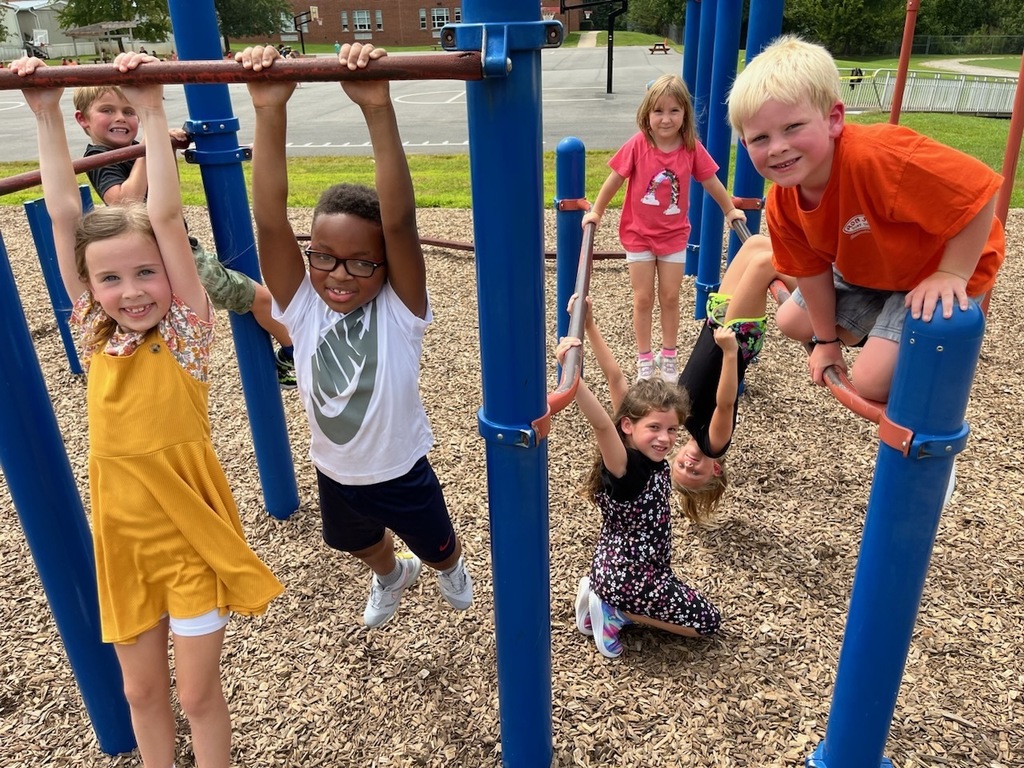 First graders play on the playground.
