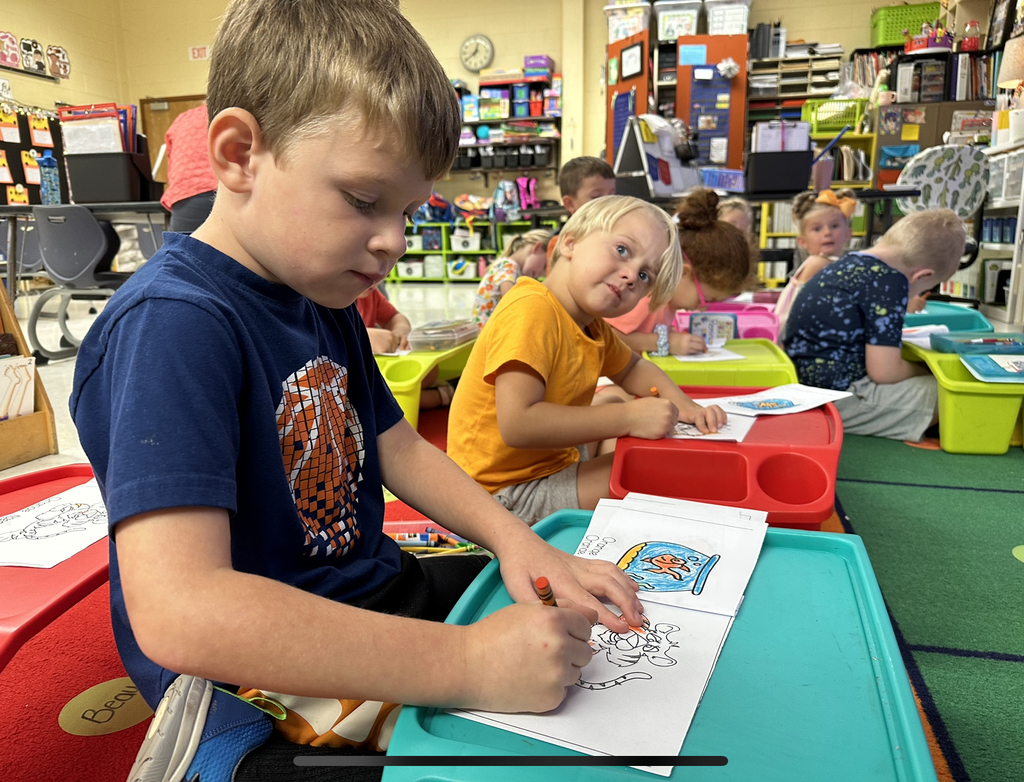 Students learn about the color orange.