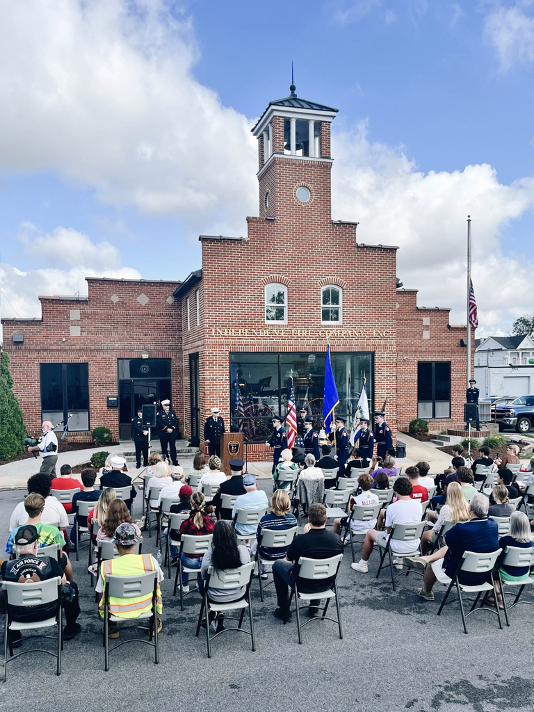 JROTC Color Guard in front of small crowd at Independent Fire Company