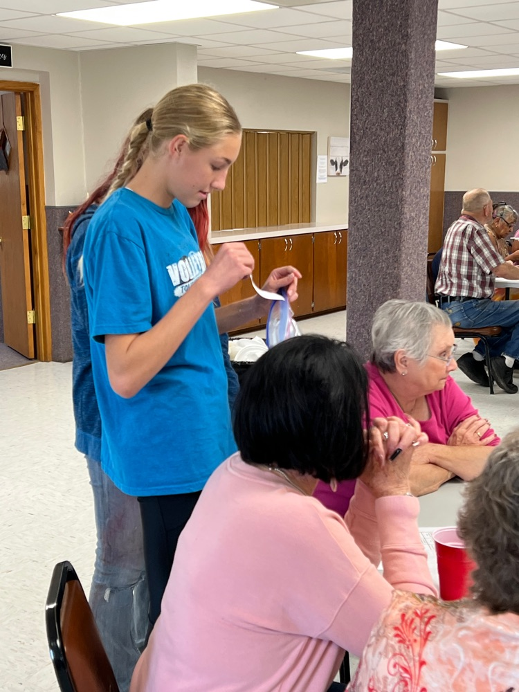 Aryn talking with residents