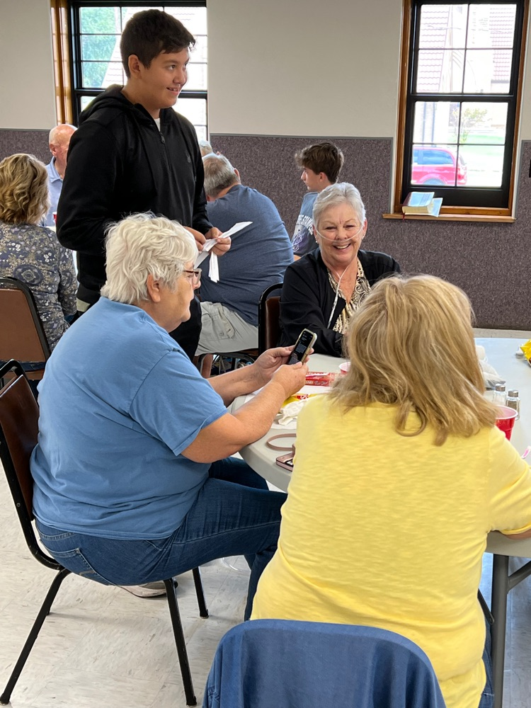 Emmanuel talking to residents