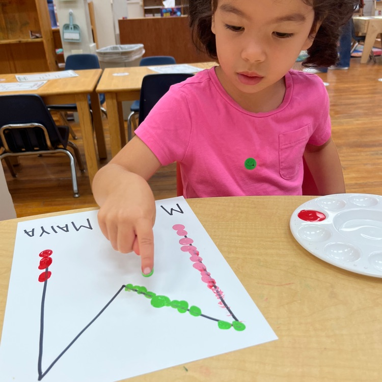 Ms. Brynn’s preschool class having fun exploring Finger painting!