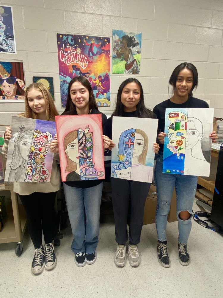 Art 2 students with their identity self-portraits ✏️🎨🖍️