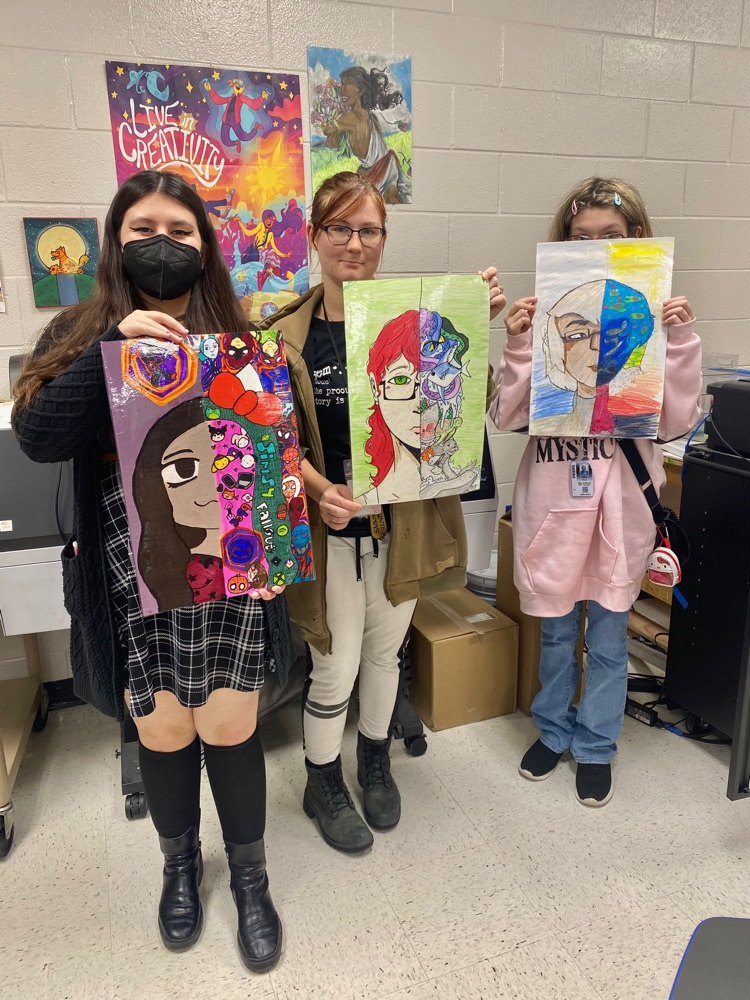 Art 2 students with their identity self-portraits ✏️🎨🖍️