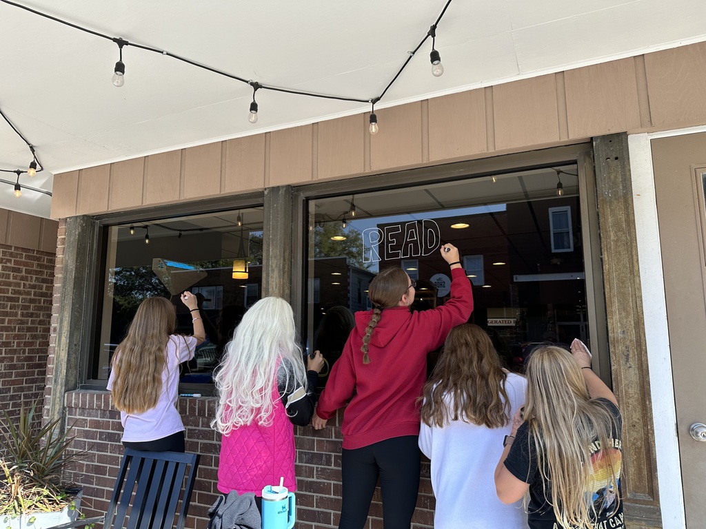 students decorating window