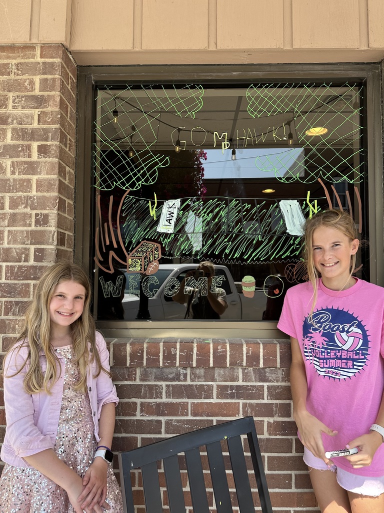 Students and decorated windows