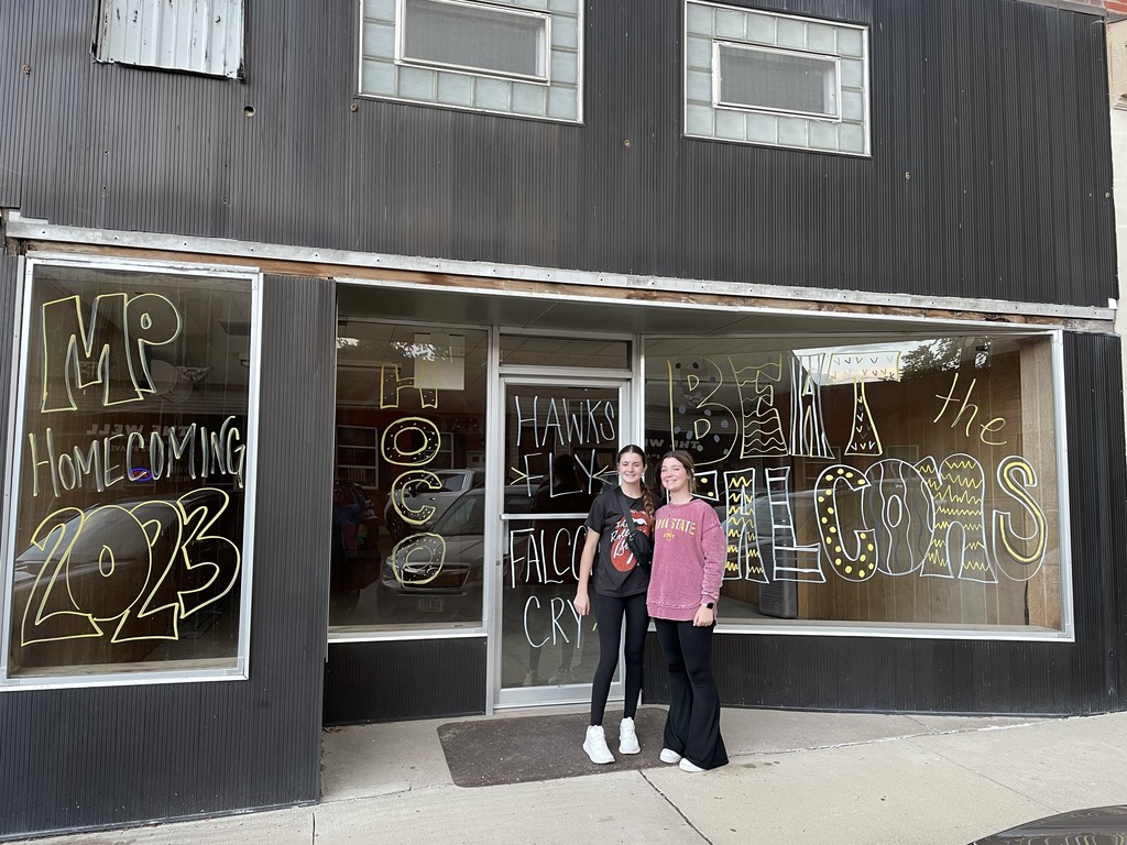 Brooklyn and Adelyn decorating windows