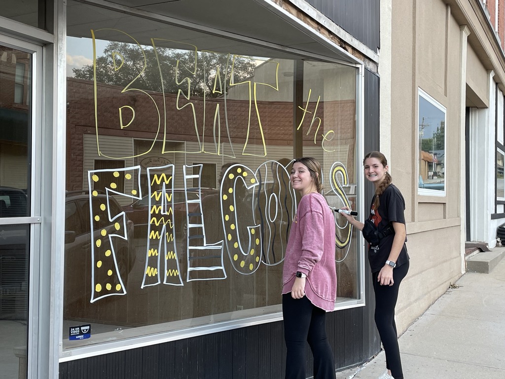 Brooklyn and Adelyn decorating windows