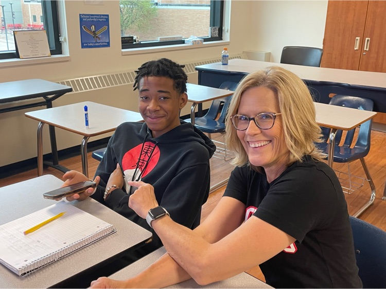 Student makes phone calls with teacher to hiring businesses
