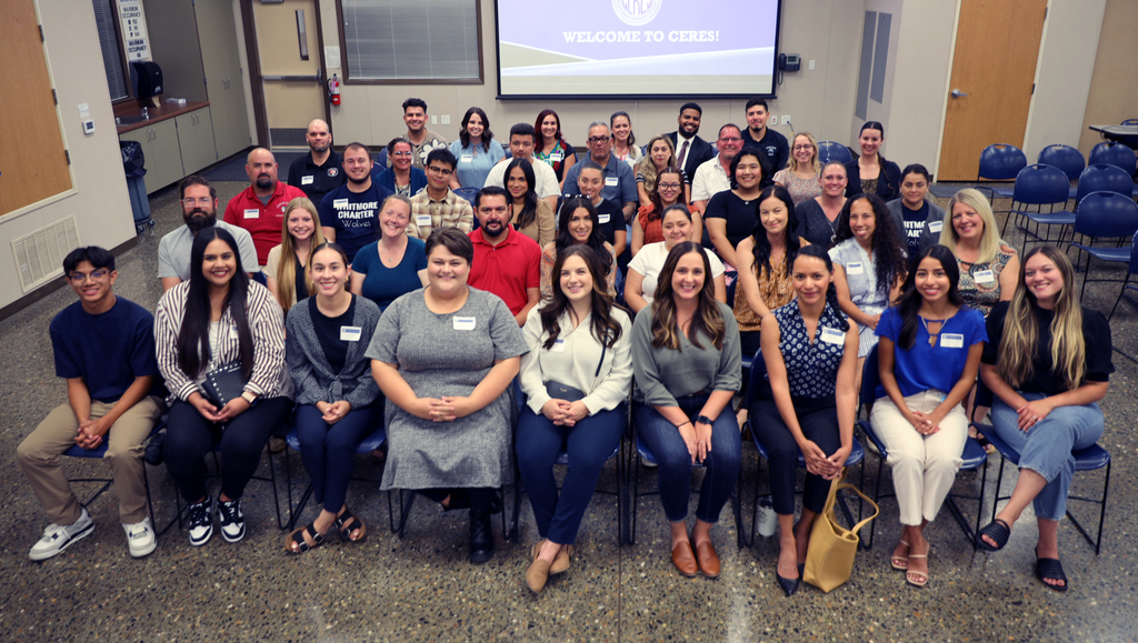 New employees seated for group photo