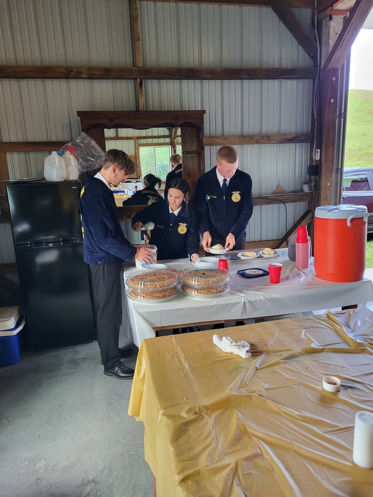 Members getting dessert ready to go serve.
