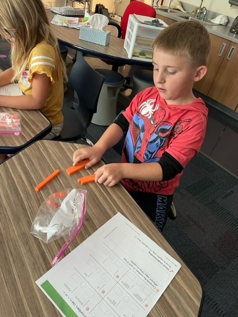 boy with orange cubes counting