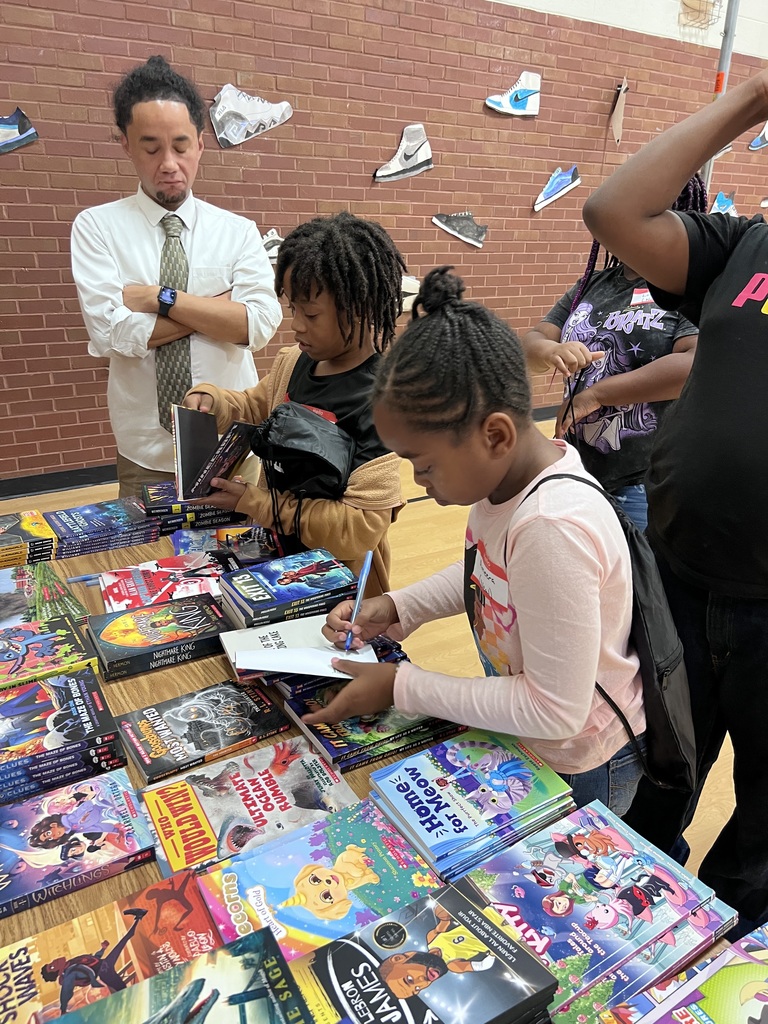 Glen Lea students write their names in their books