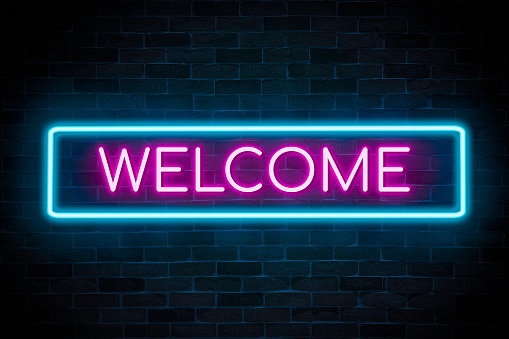 neon blue and purple welcome sign
