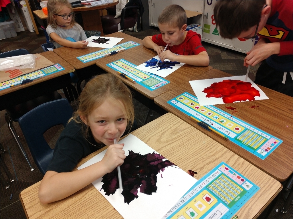 kids blowing paint