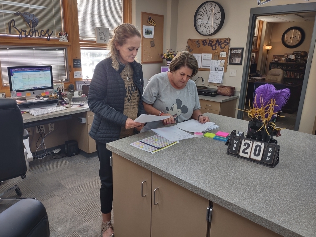 office ladies checking papers