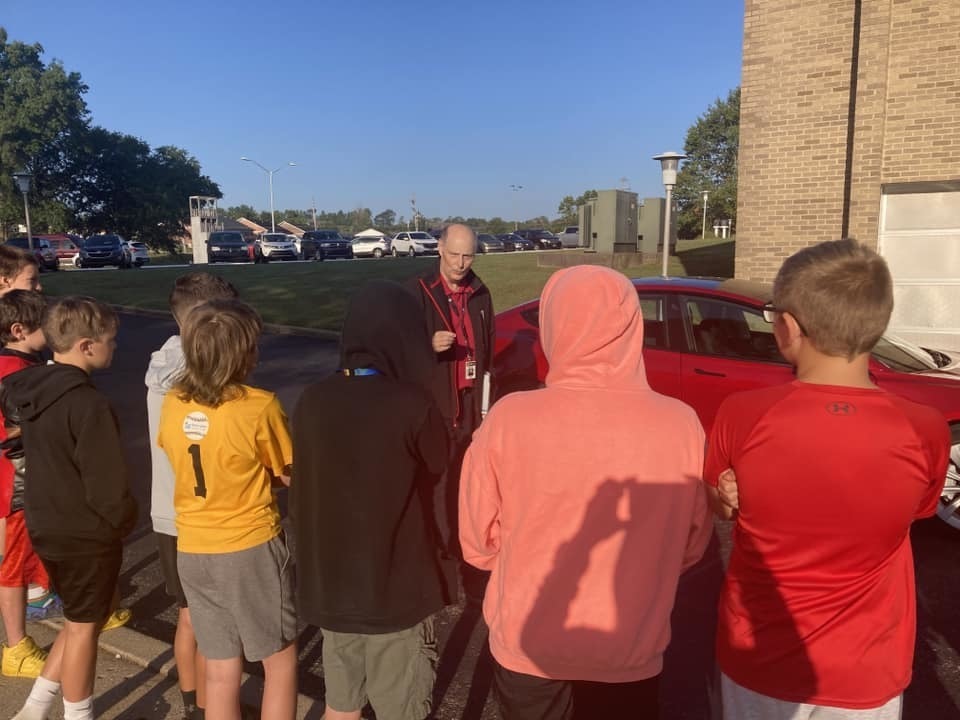 Mr. Stinett talking to students