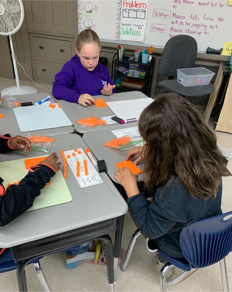 students with manipulatives
