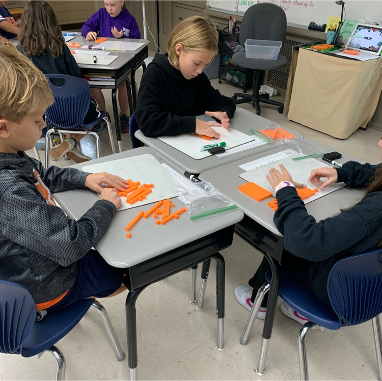 students with manipulatives