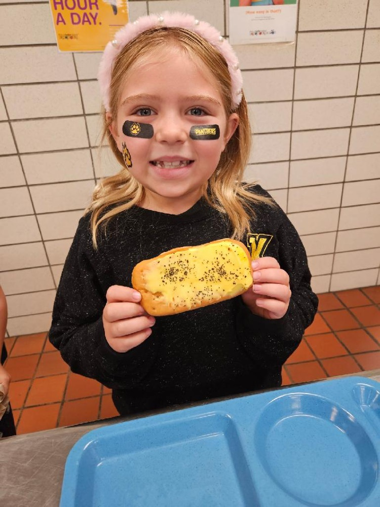 student eating donut